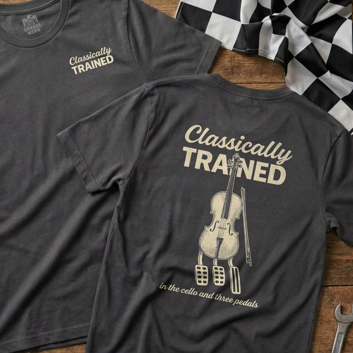 Dark grey t-shirt with a cello and pedals graphic, "Classically Trained" text.