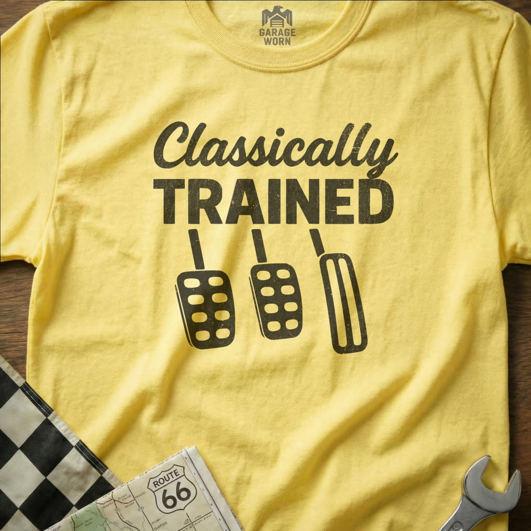 Yellow t-shirt with "Classically Trained" text and car pedals graphic.