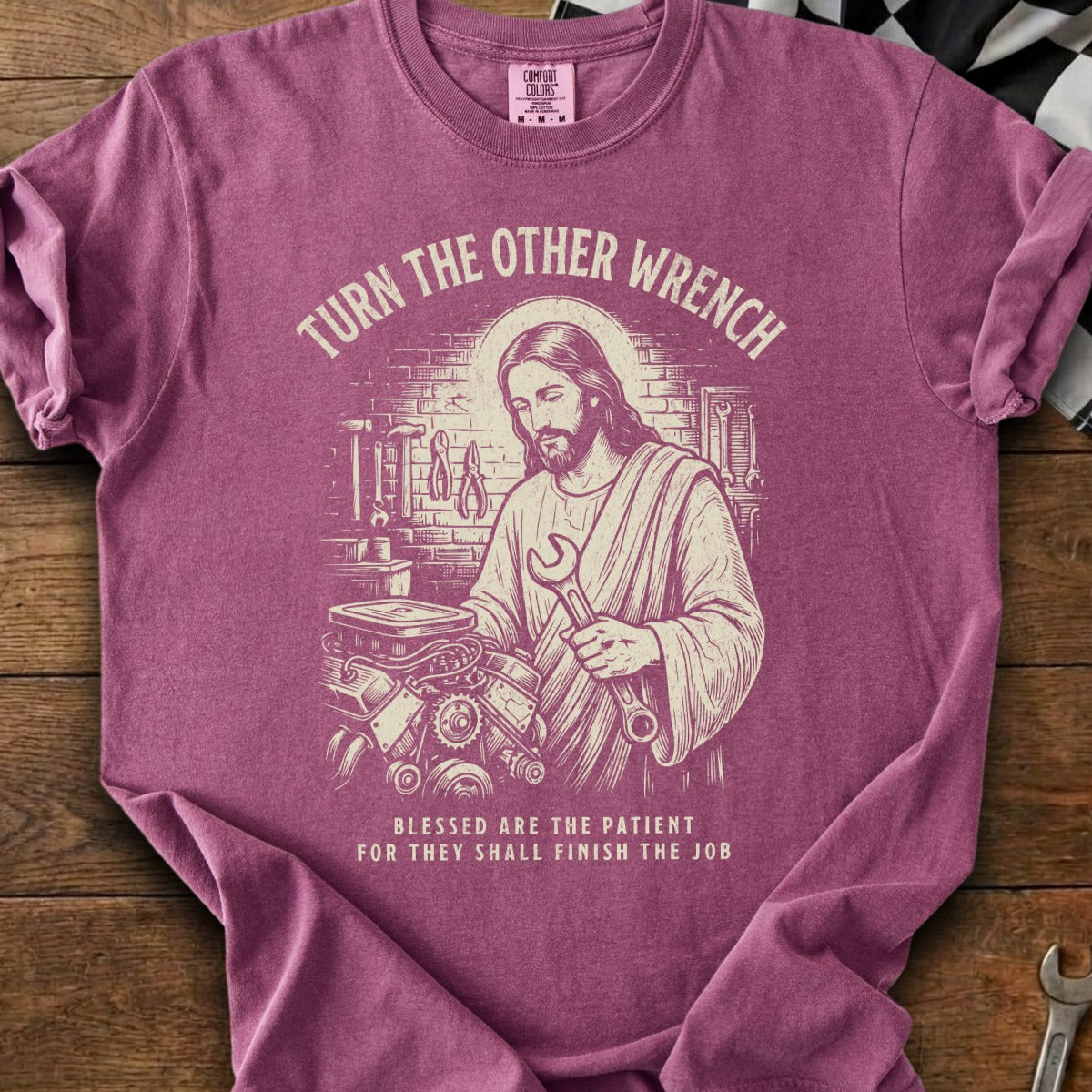 Jesus with a wrench working on an engine, "Turn The Other Wrench."