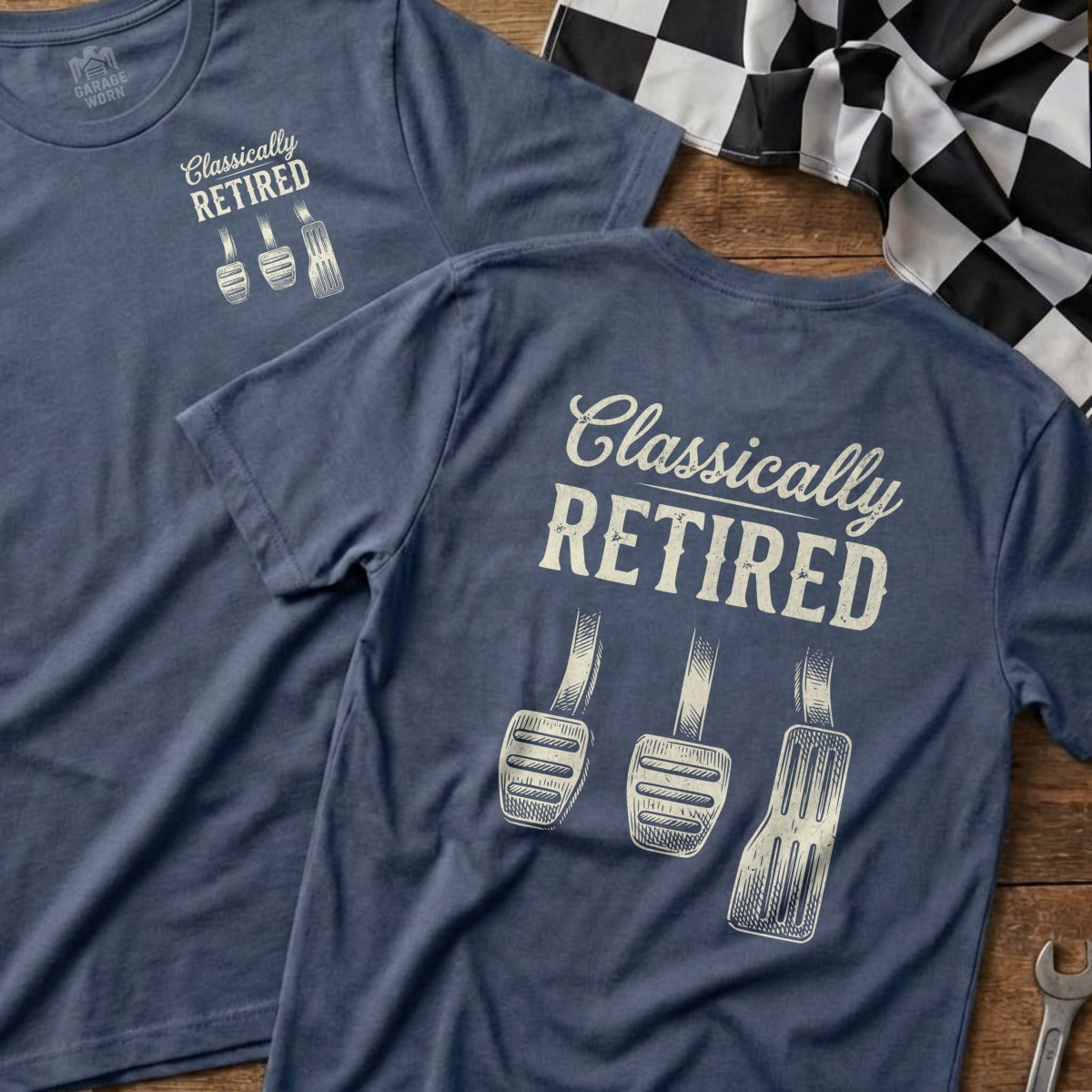 Navy t-shirt with "Classically Retired" and three pedals design.