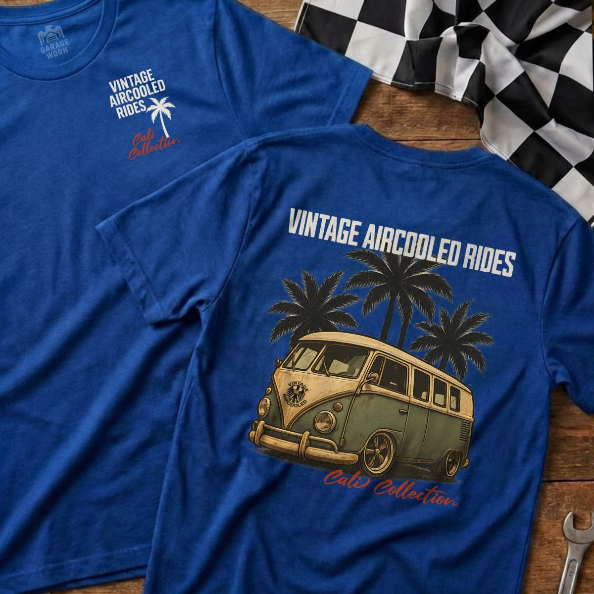Blue t-shirt with vintage camper van and palm trees graphic.