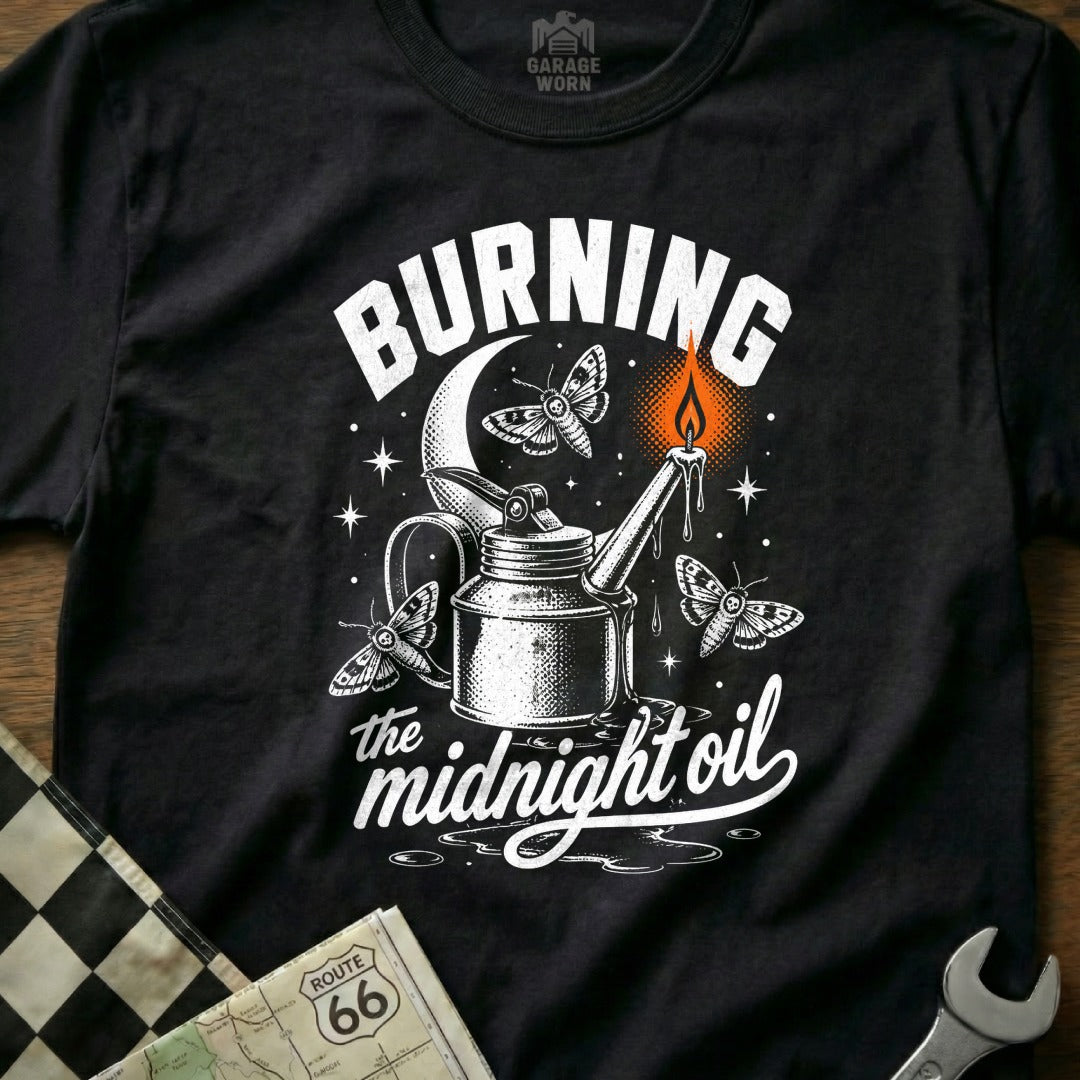Black t-shirt with "Burning the midnight oil" text and moths around an oil can.