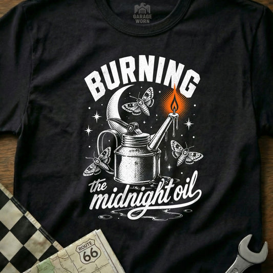 Black t-shirt with "Burning the midnight oil" text and moths around an oil can.