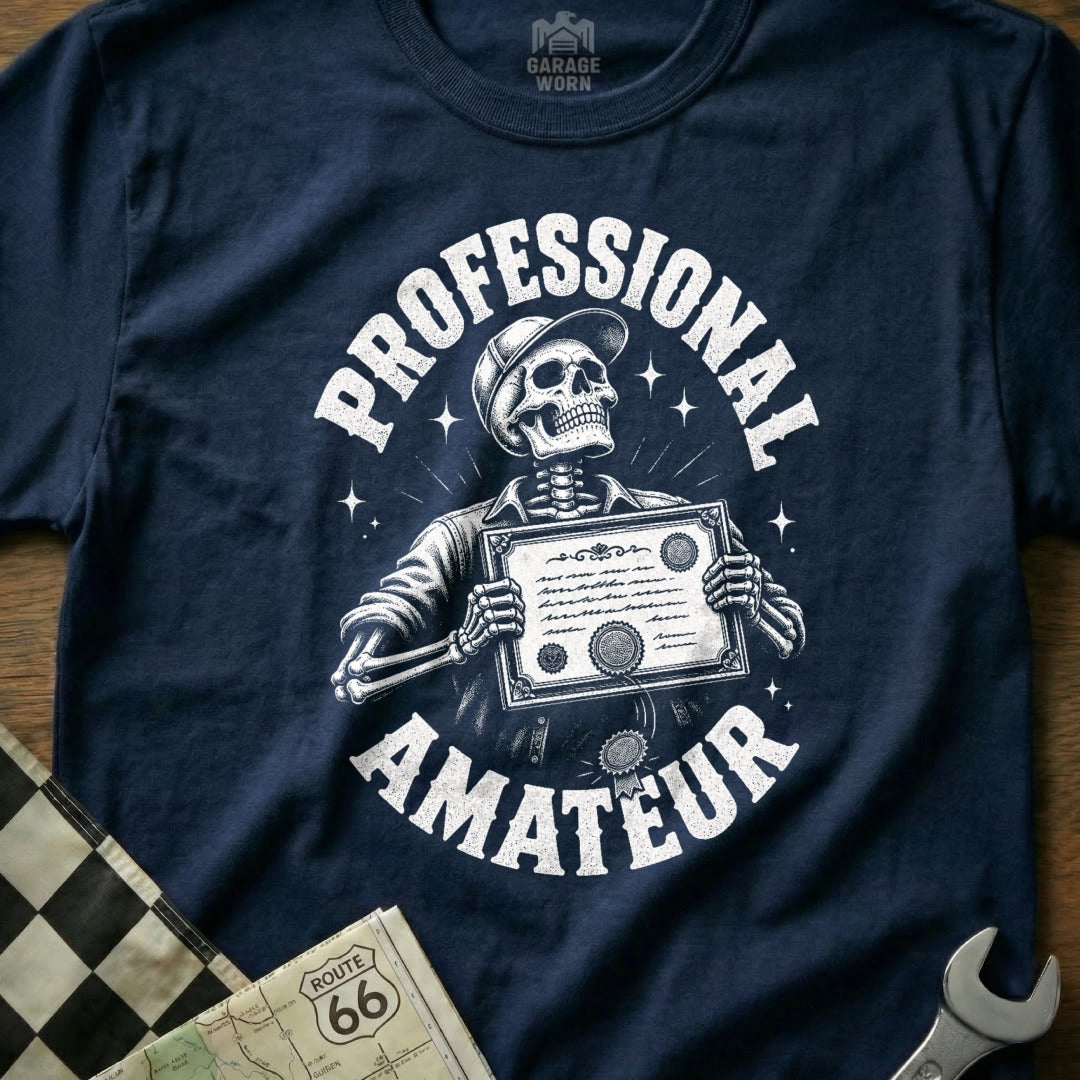 Navy t-shirt with skeleton holding "PROFESSIONAL AMATEUR" certificate.