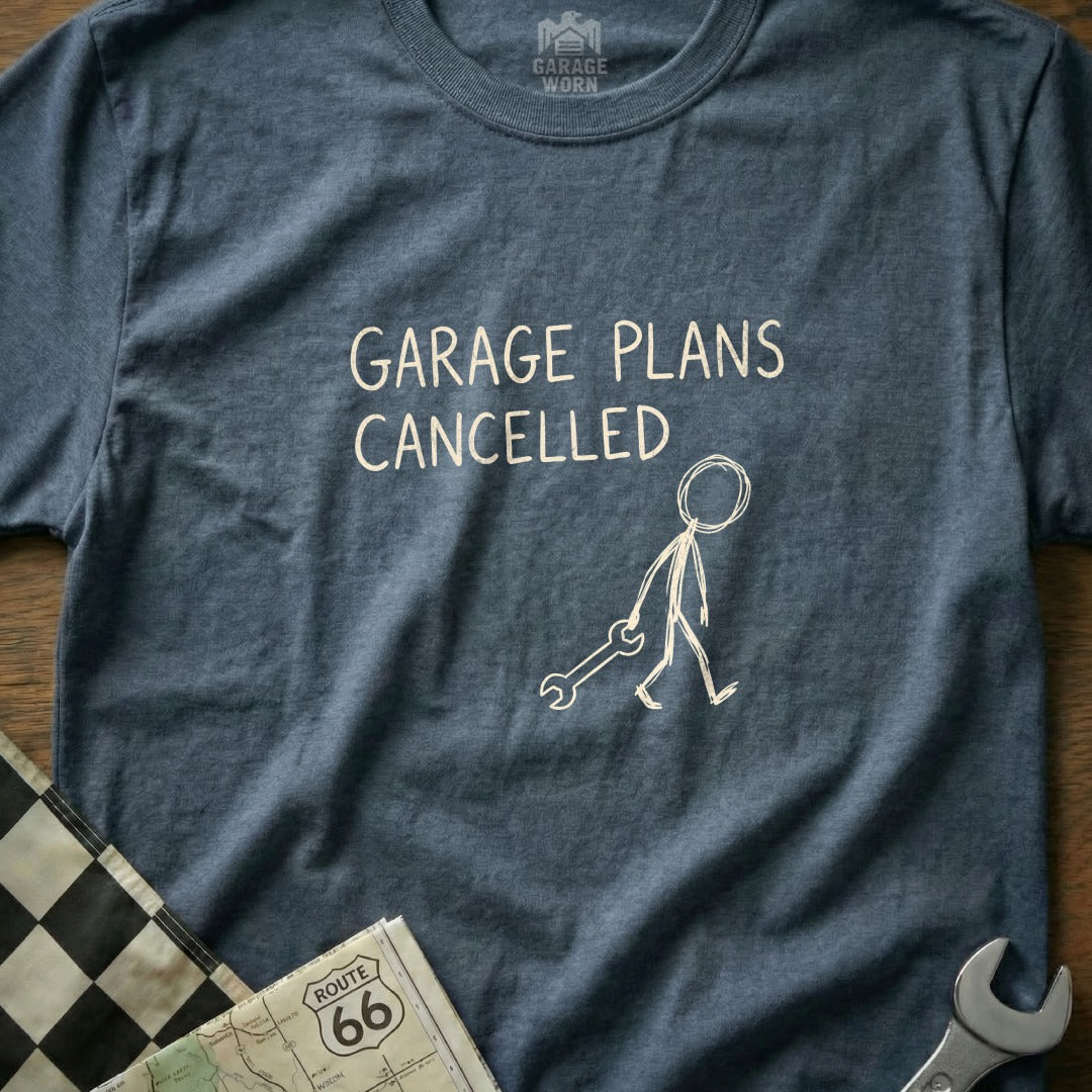 Blue t-shirt with "GARAGE PLANS CANCELLED" and a stick figure holding a wrench.