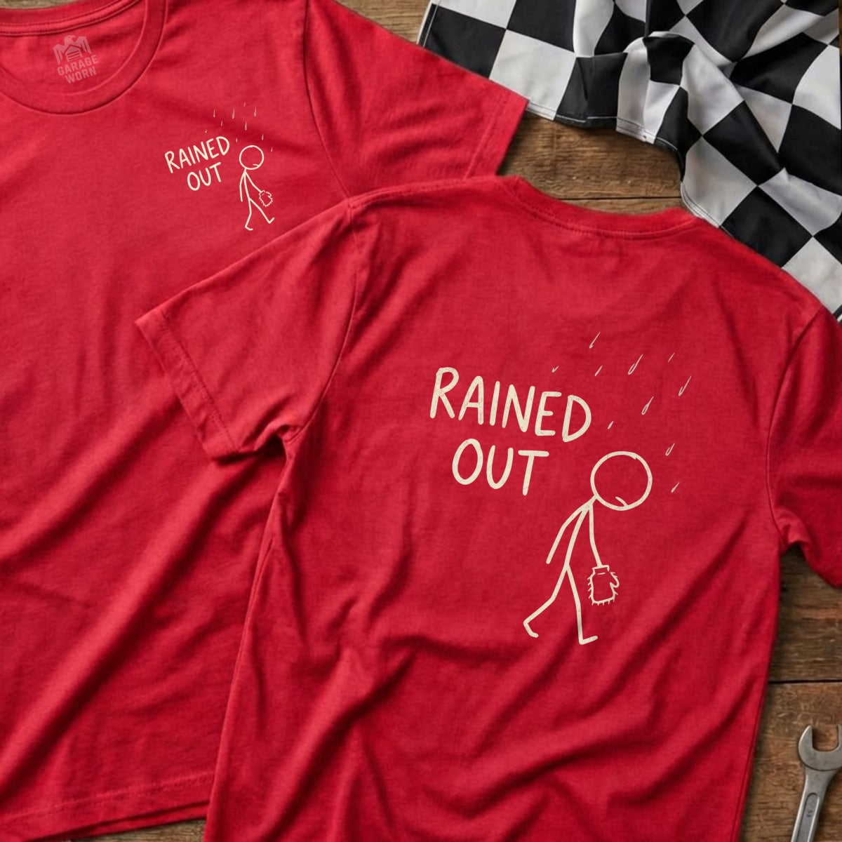 Two red t-shirts with a stick figure under rain, text "Rained Out".