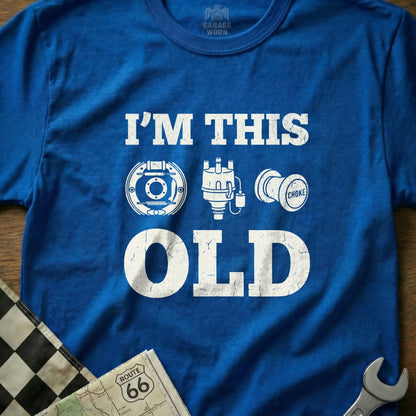 Blue t-shirt with "I'M THIS OLD" and car part graphics.