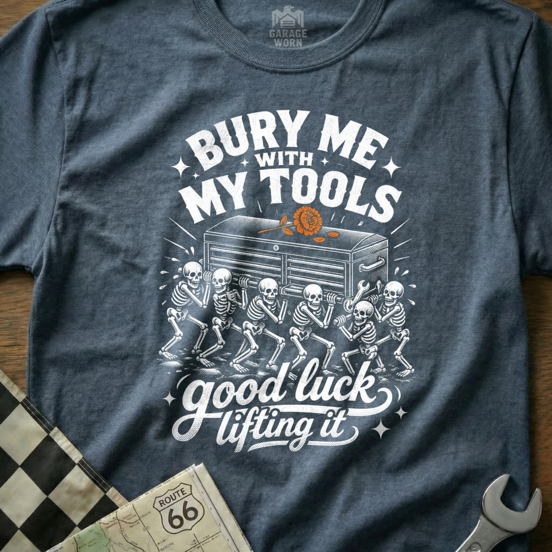 T-shirt graphic: skeletons carrying toolbox, text "Bury Me With My Tools, Good Luck Lifting It".
