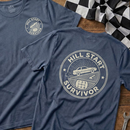 T-shirt with "Hill Start Survivor" text and gear shift graphic.