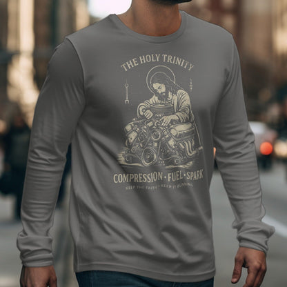 Jesus working on an engine with "The Holy Trinity" and "Compression Fuel Spark".