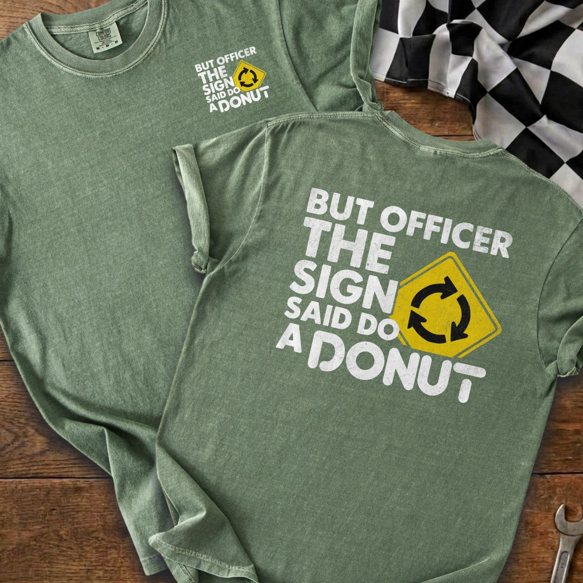 Green t-shirt with white text and yellow circular arrow sign: "But Officer The Sign Said Do A Donut".