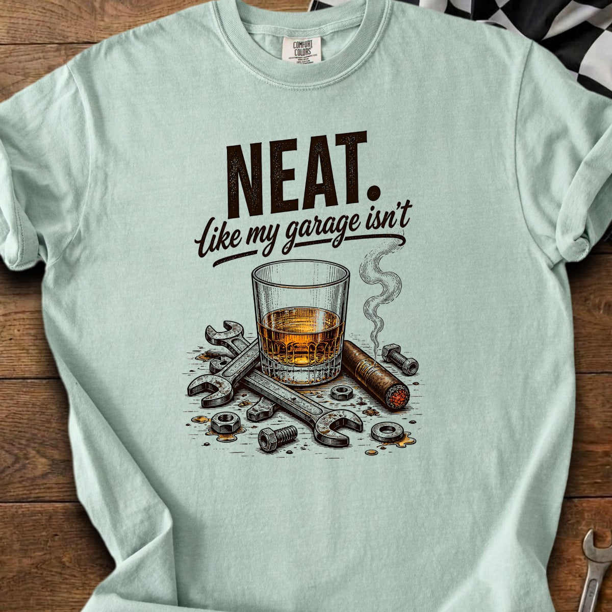 NEAT. Like my garage isn't. Whiskey, cigar, and tools graphic t-shirt.