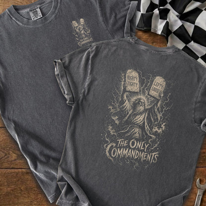 Dark grey t-shirt with a graphic of Moses holding tablets labeled "Righty Tighty" and "Lefty Loosey."