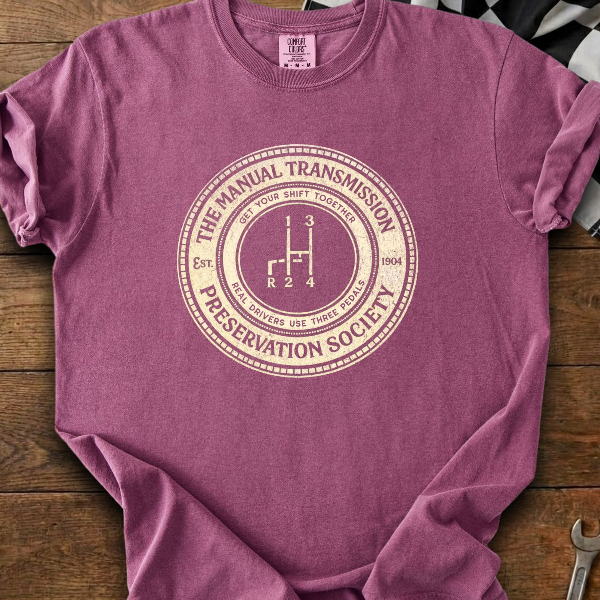 Manual Transmission Preservation Society graphic on a burgundy t-shirt.
