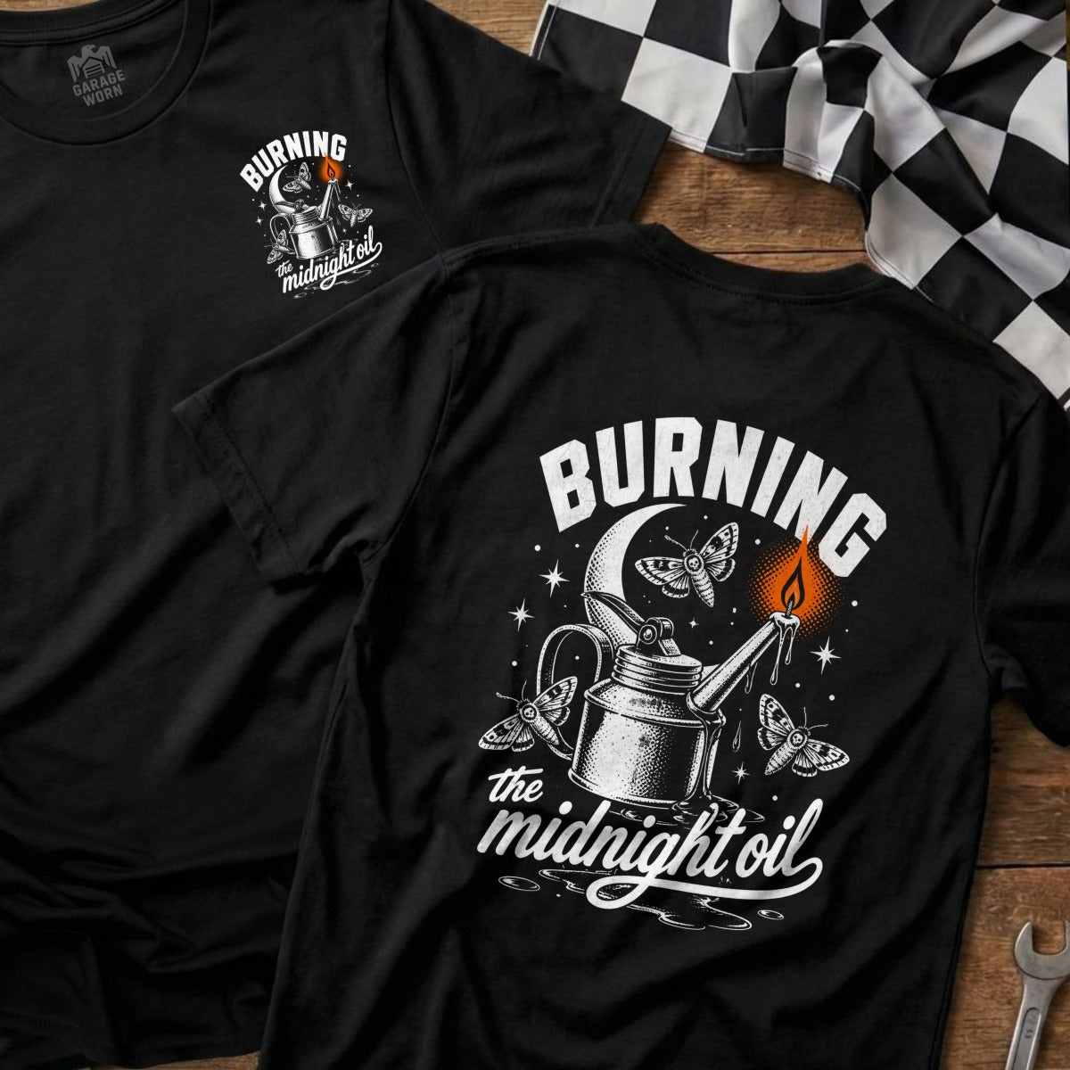 Black t-shirt graphic with oil can, moths, moon, and "Burning the midnight oil" text.