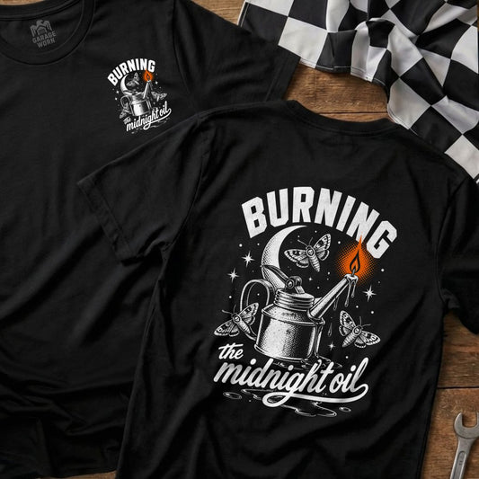 Black t-shirt graphic with oil can, moths, moon, and "Burning the midnight oil" text.
