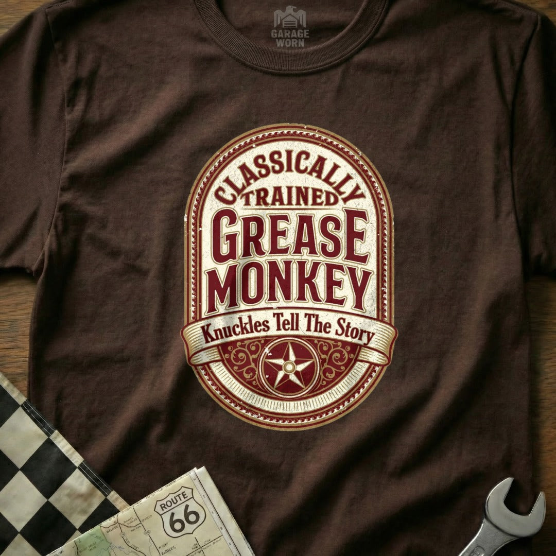 Brown t-shirt with "Classically Trained Grease Monkey" text and star design.