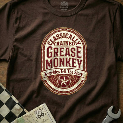 Brown t-shirt with "Classically Trained Grease Monkey" text and star design.