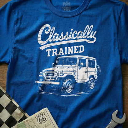 Blue t-shirt with "Classically TRAINED" text and a white vintage off-road vehicle illustration.