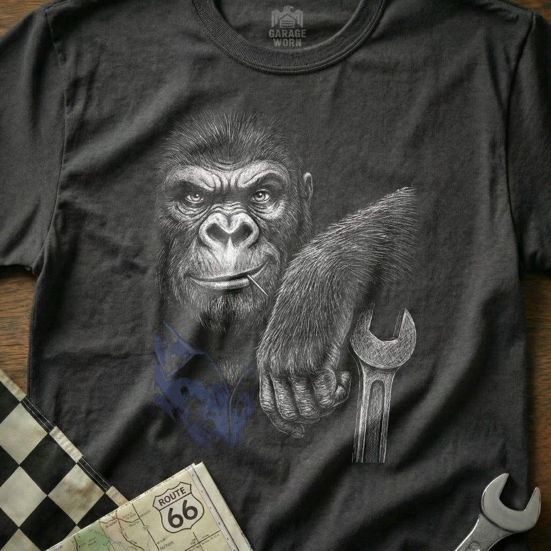 Gorilla in a blue shirt holding a wrench, with Route 66 map.