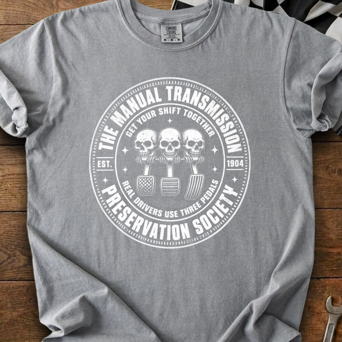 Grey t-shirt with "The Manual Transmission Preservation Society" graphic.