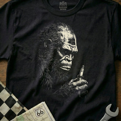 T-shirt graphic of a gorilla holding a spark plug with Route 66 map.
