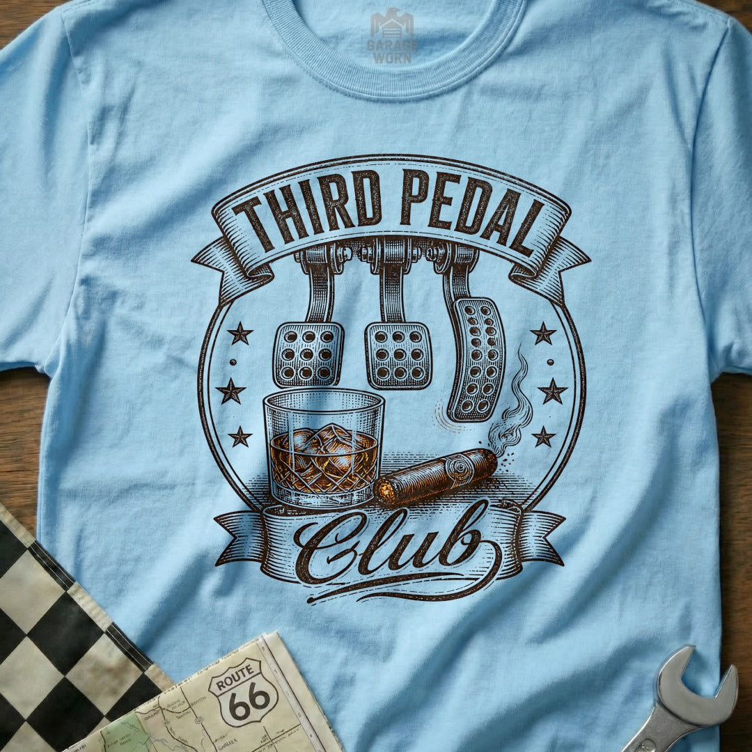 Light blue t-shirt with "Third Pedal Club" text, car pedals, whiskey, and cigar design.