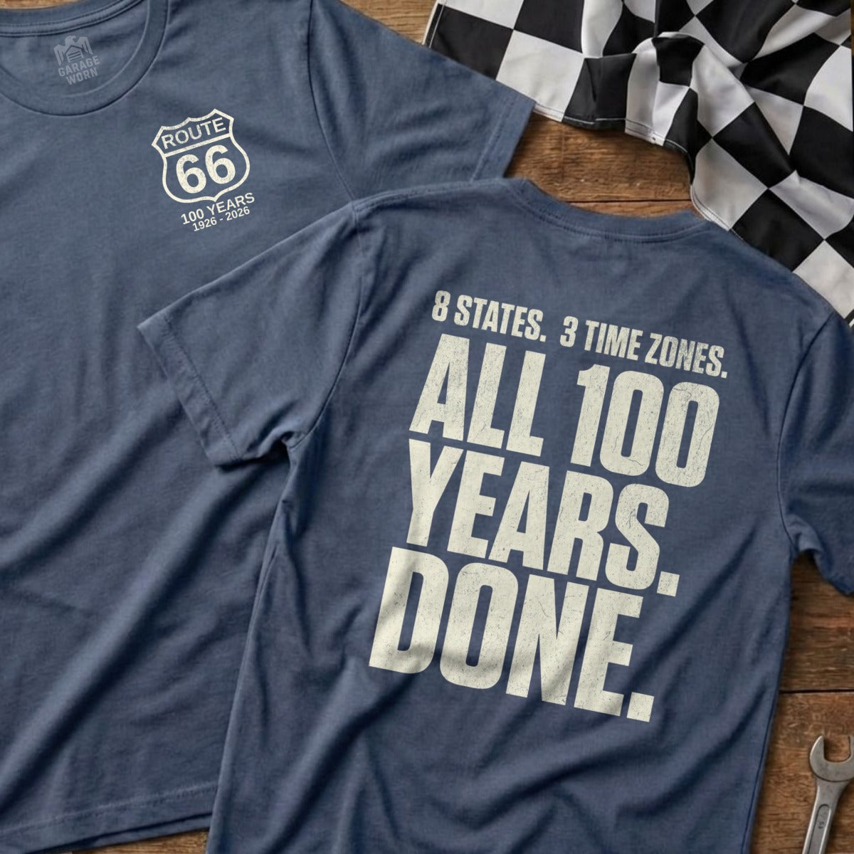 Blue t-shirt with Route 66 logo and "100 Years 1926-2026" on front, text on back.