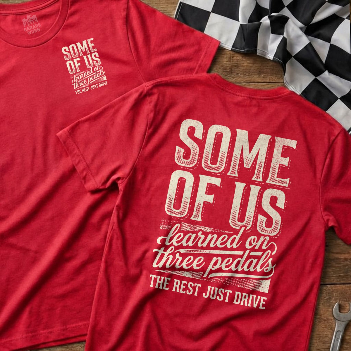 Red t-shirts with "Some of Us Learned on Three Pedals, The Rest Just Drive" text.
