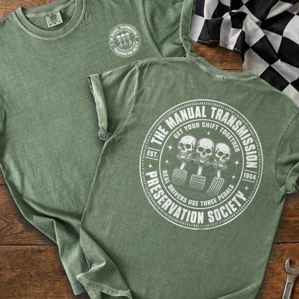 Green t-shirt with "The Manual Transmission Preservation Society" graphic.