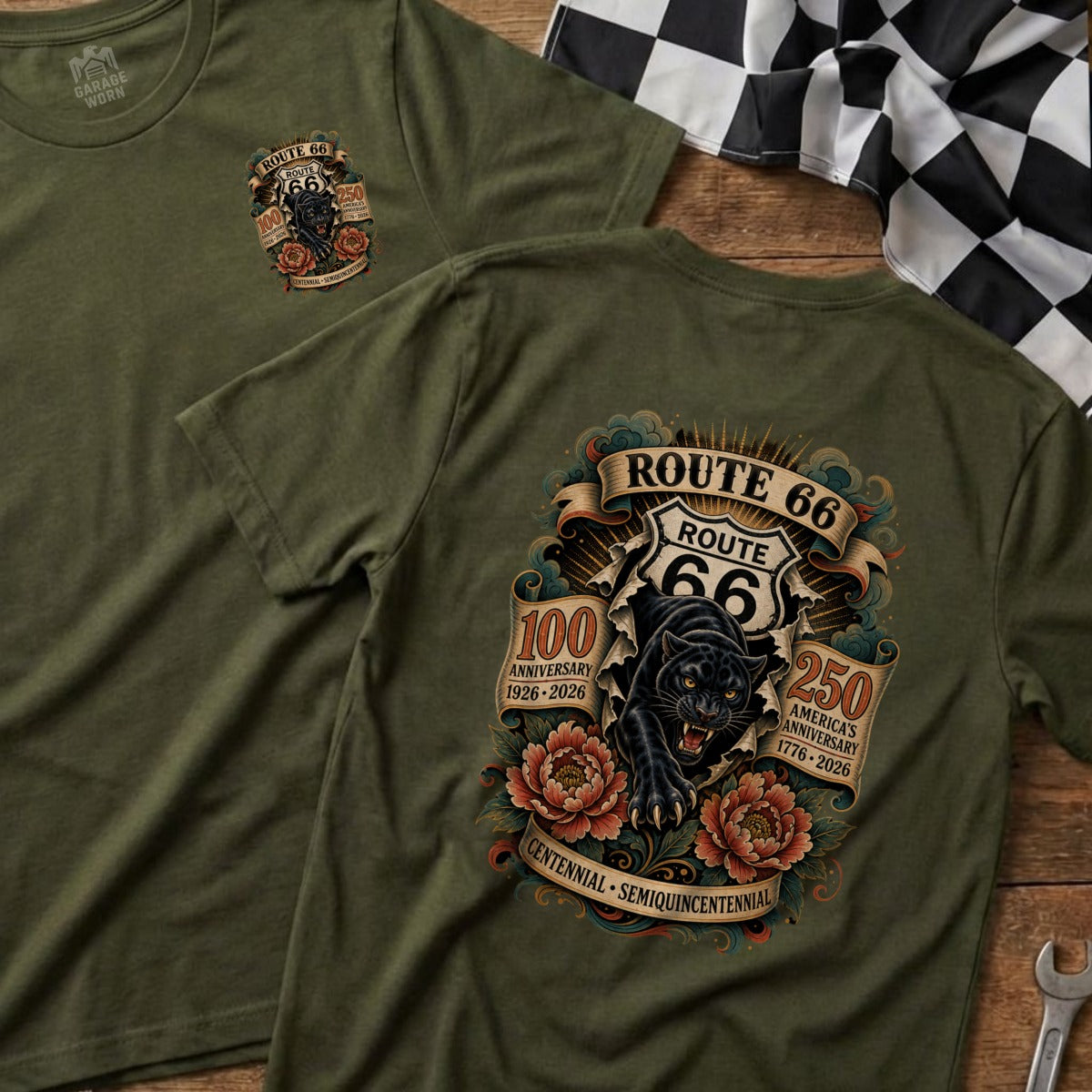Olive green t-shirt featuring a black panther bursting through Route 66 signage celebrating 100th and 250th anniversaries.