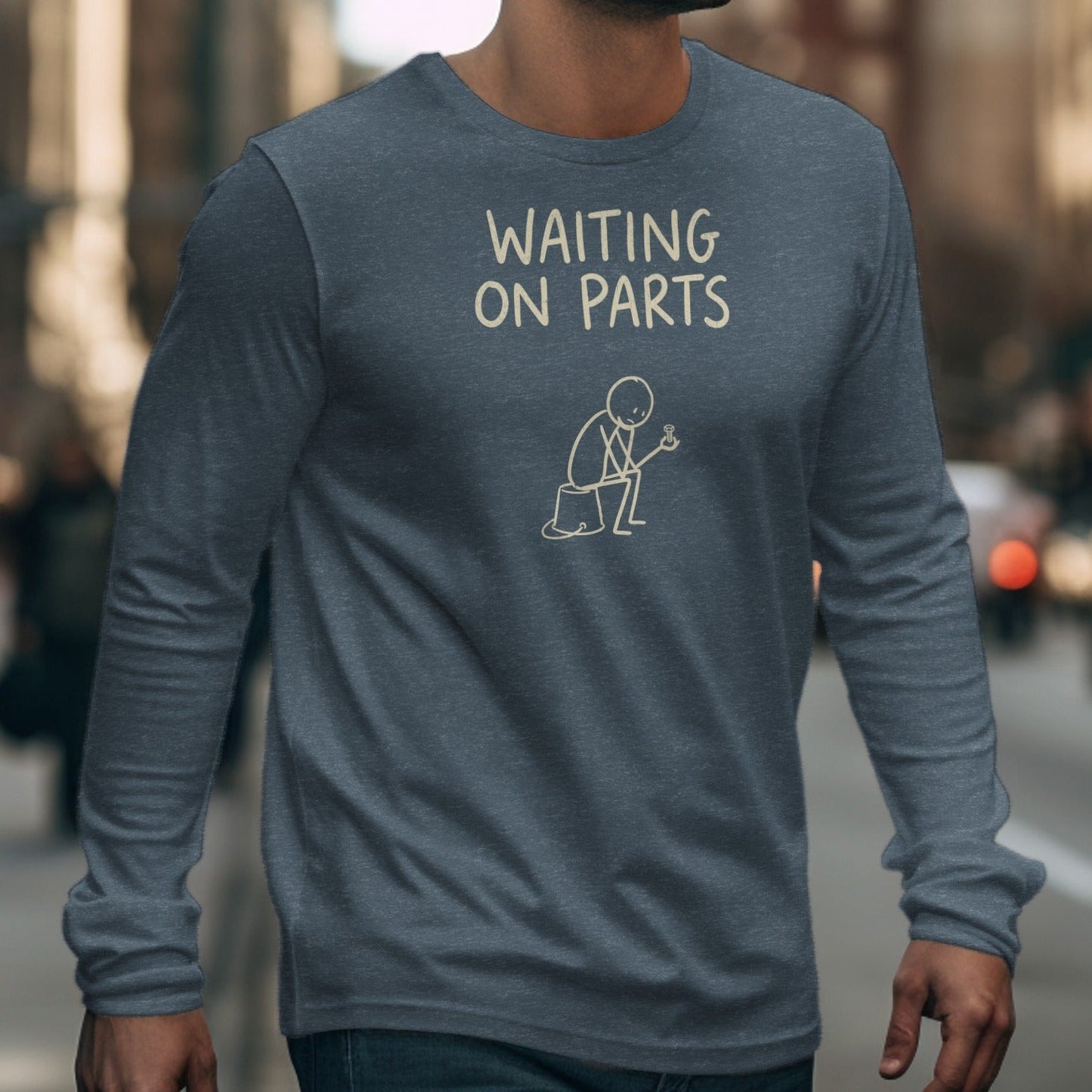 Dark gray long-sleeve shirt with "WAITING ON PARTS" and stick figure graphic.