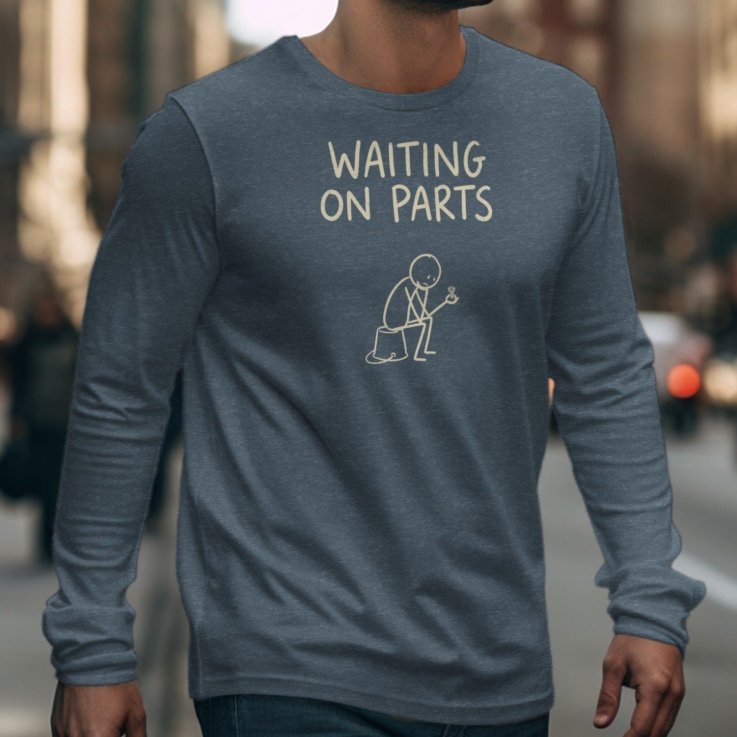 Dark gray long-sleeve shirt with "WAITING ON PARTS" and stick figure graphic.