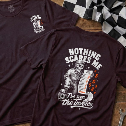 Dark t-shirt with skeleton holding an invoice and "Nothing scares me" text.