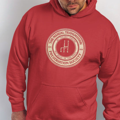 Red hoodie with "The Manual Transmission Preservation Society" circular graphic.
