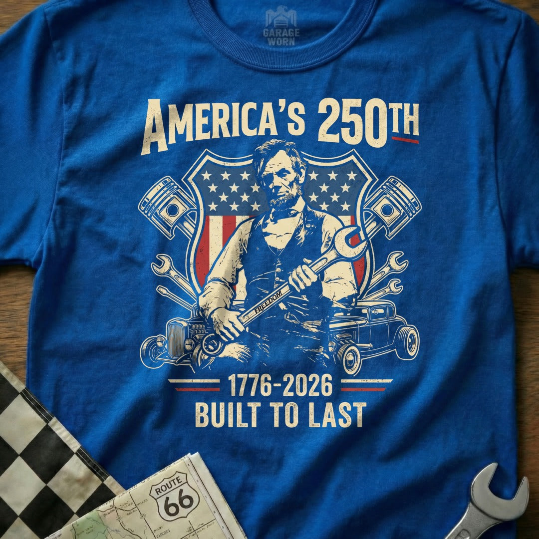 Blue t-shirt featuring Abraham Lincoln holding wrenches with "America's 250th" and "Built to Last".