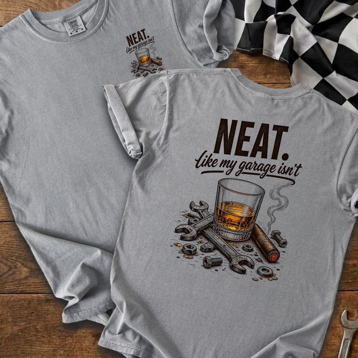 Gray t-shirt with "NEAT. like my garage isn't" text and graphic.