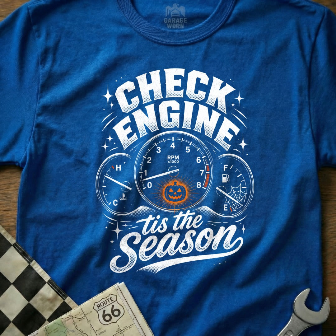 Blue t-shirt with "Check Engine 'tis the Season" text and pumpkin dashboard graphic.