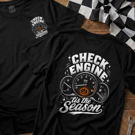 Black t-shirt with "Check Engine" and pumpkin graphic, "tis the Season" text.