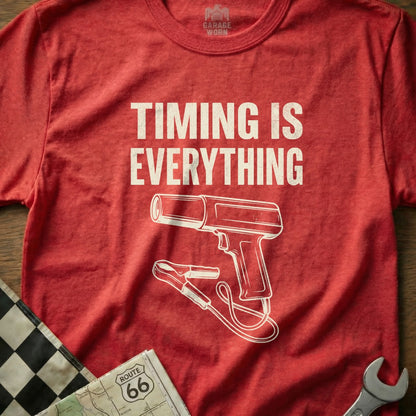 Red t-shirt with "TIMING IS EVERYTHING" and a timing gun graphic.