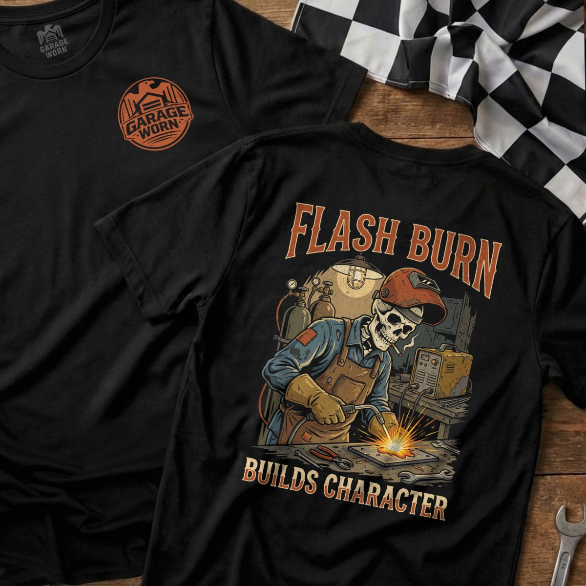 Black t-shirt with skeleton welder graphic and "Flash Burn Builds Character" text.