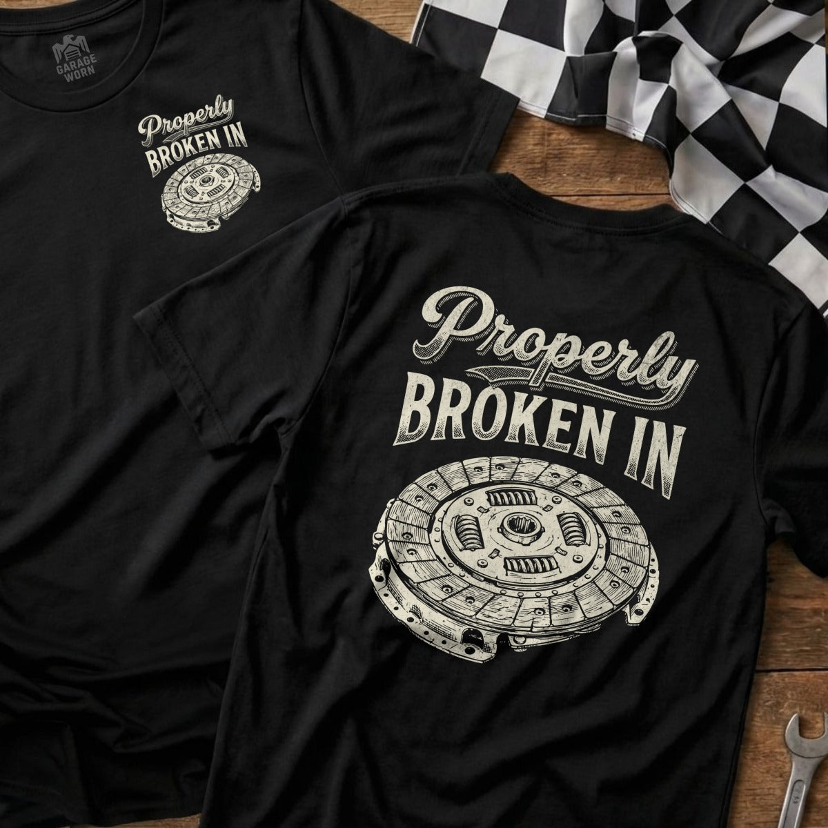 Black t-shirt with a clutch disc graphic and "Properly Broken In" text.
