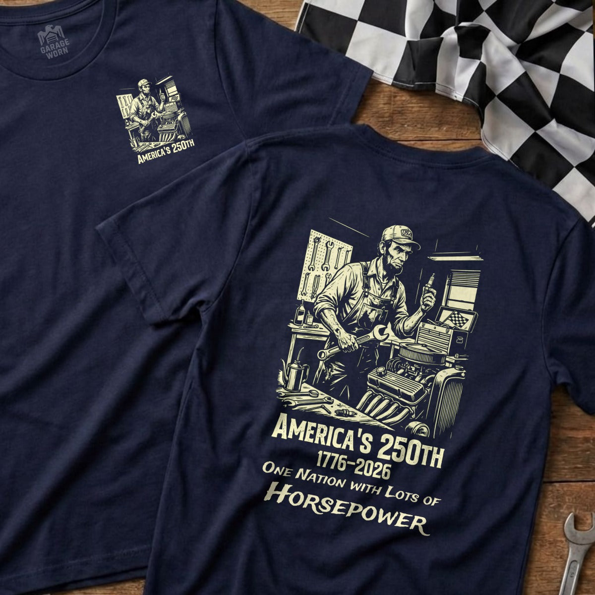 Navy t-shirt with a mechanic working on an engine, text "America's 250th" and "Horsepower".