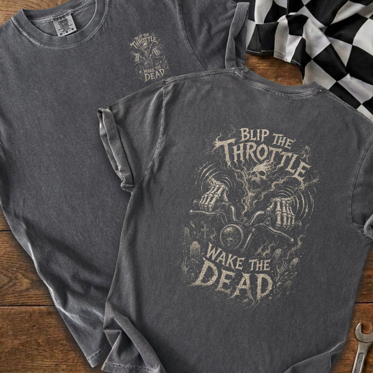Dark gray t-shirt with "Blip the Throttle Wake the Dead" graphic of skeleton riding motorcycle.