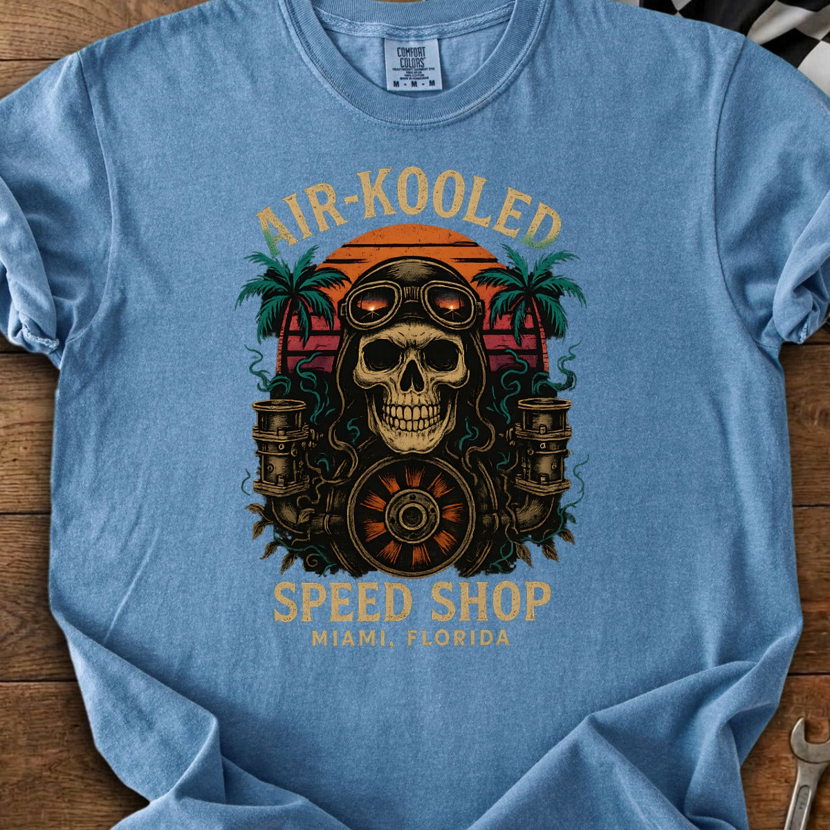 Skull wearing goggles with "Air-Kooled Speed Shop Miami, Florida" text.