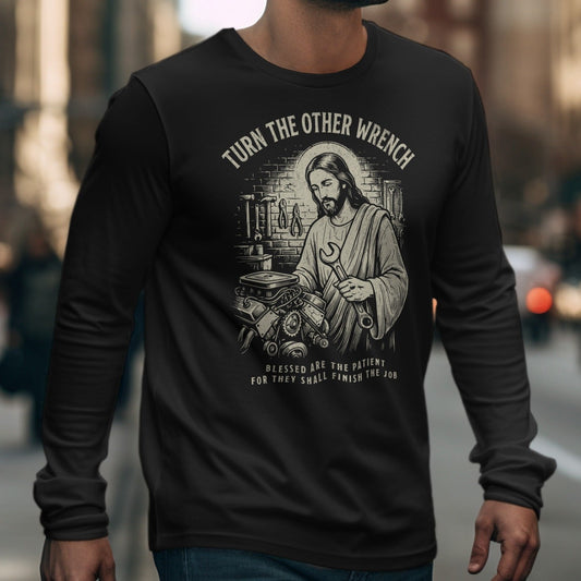 Black long-sleeve shirt with Jesus holding a wrench and text "TURN THE OTHER WRENCH".