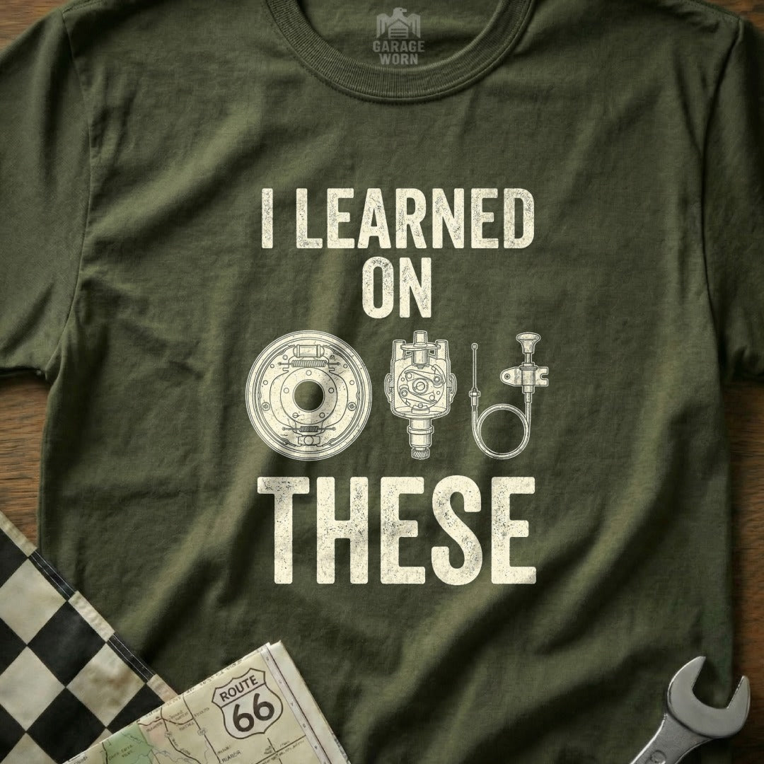 T-shirt with "I LEARNED ON THESE" and diagrams of automotive parts.