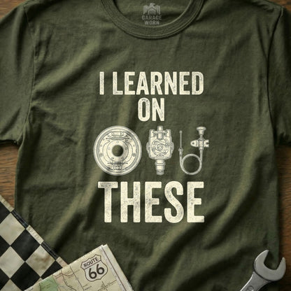 T-shirt with "I LEARNED ON THESE" and diagrams of automotive parts.