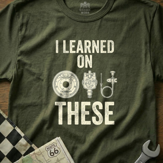 T-shirt with "I LEARNED ON THESE" and diagrams of automotive parts.