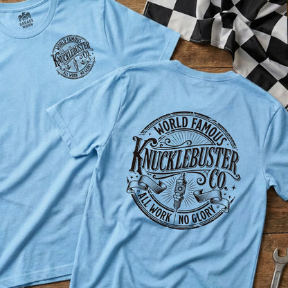 Light blue t-shirt with "World Famous Knucklebuster Co. All Work No Glory" circular graphic.